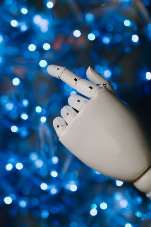 Robotic hand in front of impressionistic neural network